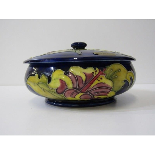 2 - MOORCROFT, Moorcroft shallow lidded dish, decorated hibiscus pattern on a blue ground, 70cm diameter