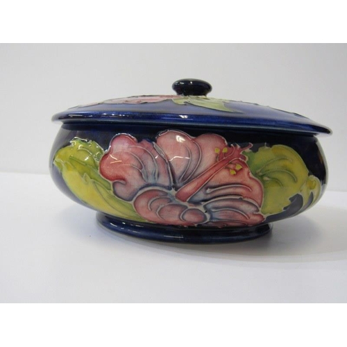 2 - MOORCROFT, Moorcroft shallow lidded dish, decorated hibiscus pattern on a blue ground, 70cm diameter