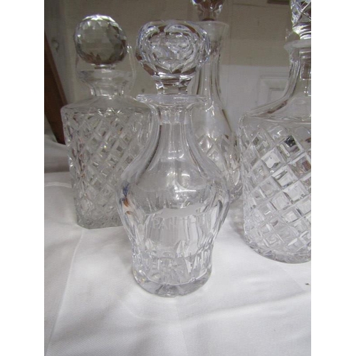 22 - DECANTERS, 4 assorted cut glass decanters