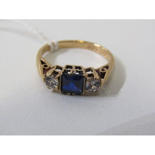 233 - 3 STONE DRESS RING, 9ct yellow gold ring set a central stone form sapphire, surrounded by 2 clear st... 