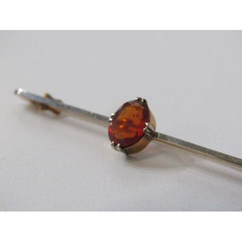 247 - 9ct GOLD BAR BROOCH, set an oval orange stone possibly a hessonite garnet, 2.8 grams