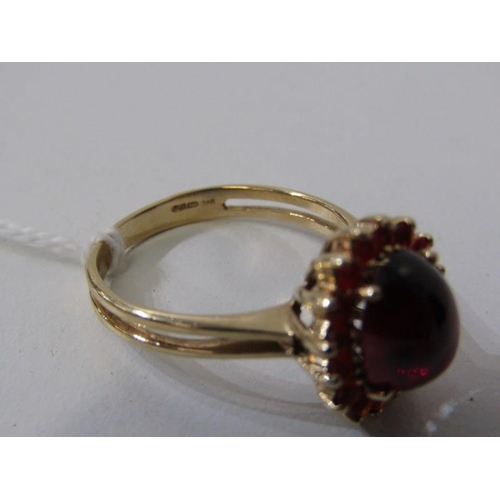 254 - GARNET & FIRE OPAL RING, 9ct yellow gold ring set a cabochon garnet, surrounded by a cluster of fire... 