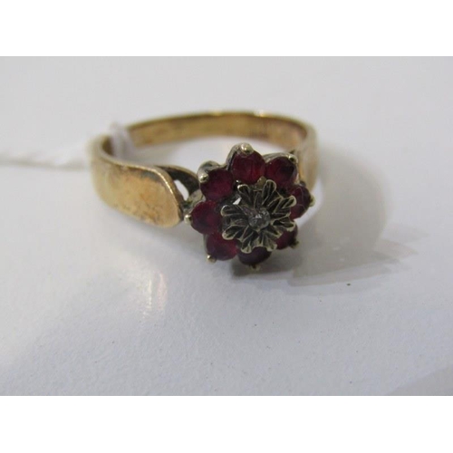 260 - RUBY & DIAMOND CLUSTER RING, 9ct yellow gold ring set a central diamond, surrounded by a cluster of ... 