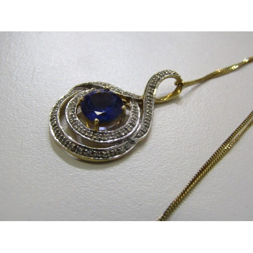 262 - TANZANITE & DIAMOND PENDANT, 9ct yellow gold pendant, set a large circular tanzanite, 8mm diameter, ... 