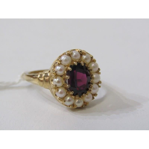 285 - GARNET & PEARL CLUSTER RING, 9ct yellow gold ring, set an oval garnet within a cluster of pearls, si... 