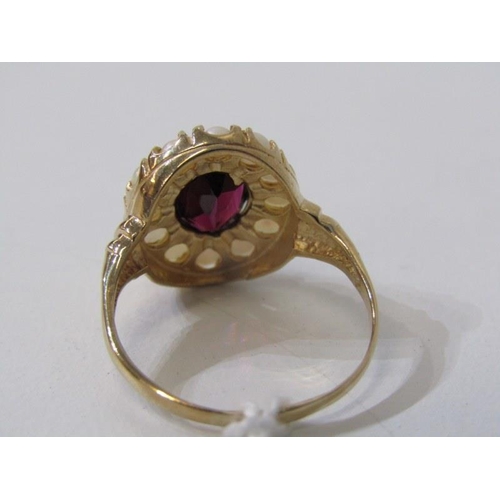 285 - GARNET & PEARL CLUSTER RING, 9ct yellow gold ring, set an oval garnet within a cluster of pearls, si... 