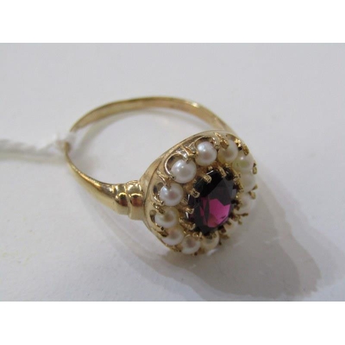 285 - GARNET & PEARL CLUSTER RING, 9ct yellow gold ring, set an oval garnet within a cluster of pearls, si... 