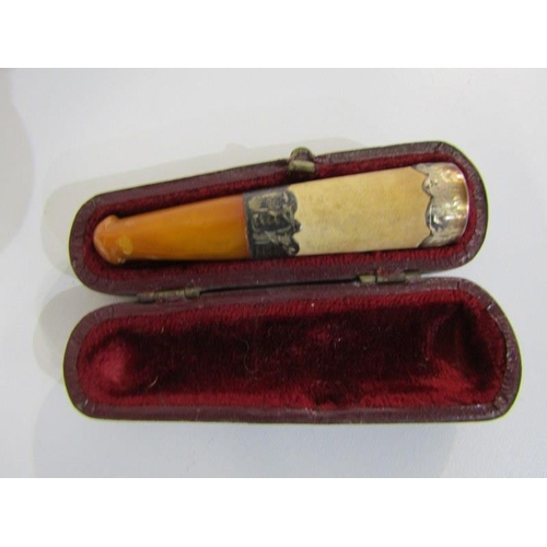 304 - CHEROOT HOLDERS, amber cheroot holder with 9ct gold mounts, in a white metal carry case, a large cig... 