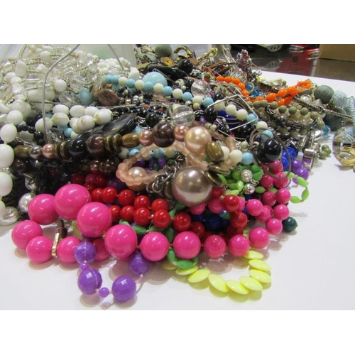 332 - BEADED NECKLACES, 2 tubs of colourful beaded necklaces and faux style pearls, also earrings and othe... 