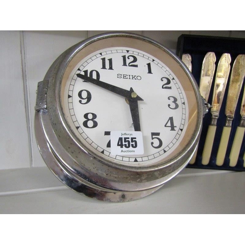 455 - SEIKO, chrome surround ships clock, case set of fish eaters & box of early penguin books