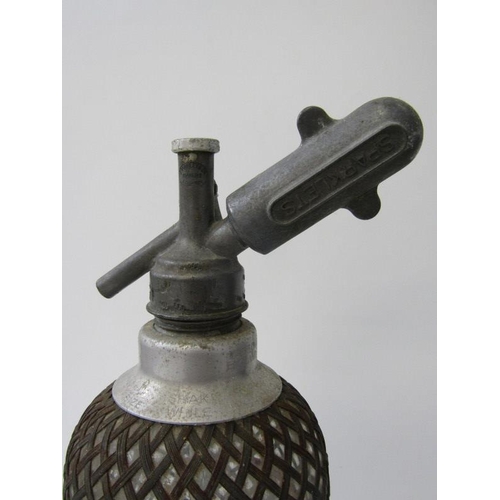 47 - VINTAGE SODA SIPHON, in lattice plated casing