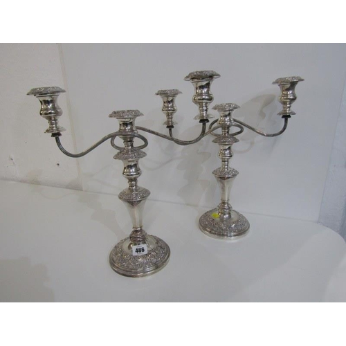 486 - SILVERPLATE,  a pair of plated copper twin branch candelabras