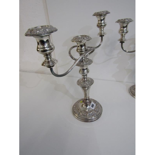 486 - SILVERPLATE,  a pair of plated copper twin branch candelabras