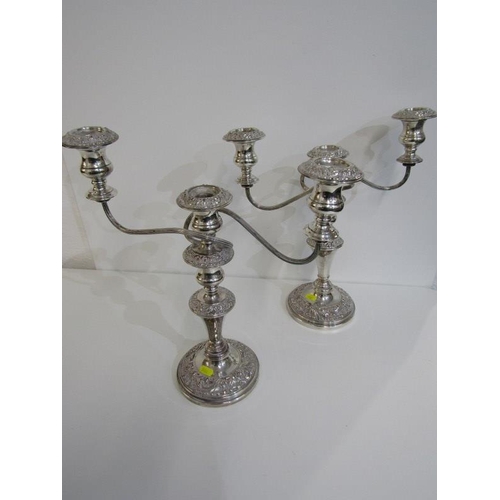 486 - SILVERPLATE,  a pair of plated copper twin branch candelabras