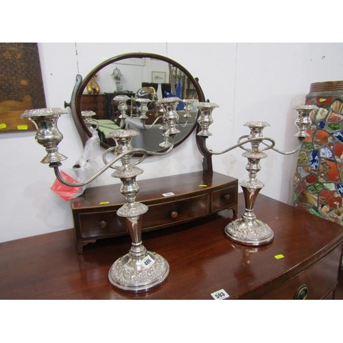 486 - SILVERPLATE,  a pair of plated copper twin branch candelabras