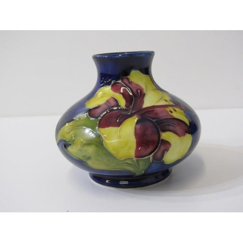 5 - MOORCROFT, Hibiscus pattern lidded pot, 9cm height, together with a squat form posy vase