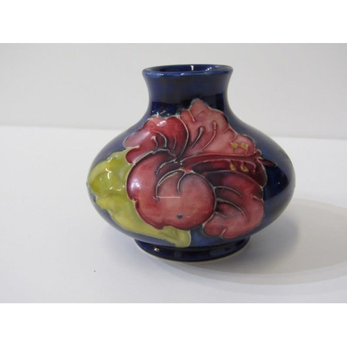 5 - MOORCROFT, Hibiscus pattern lidded pot, 9cm height, together with a squat form posy vase