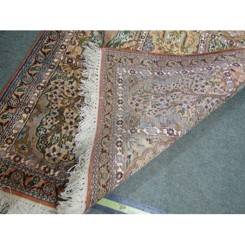 516 - PERSIAN DESIGN RUG, on pink ground, 62