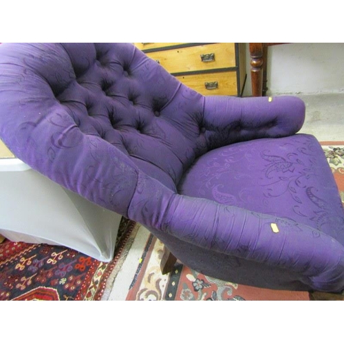 582 - VICTORIAN PURPLE BUTTON BACK ARMCHAIR with original castors