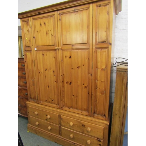 597 - PINE DOUBLE DOOR WARDROBE, robe above 4 drawer base, 137 width