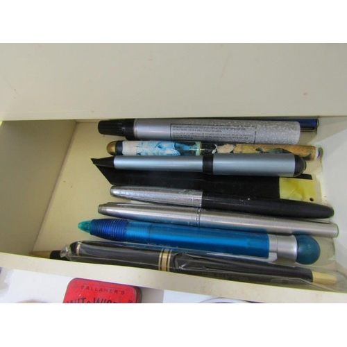 63 - PENS, white desk top cabinet containing selection of fountain and ball point pens, also a tin of bad... 