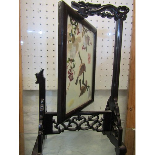 418 - ORIENTAL TABLE SCREEN, carved rosewood revolving table screen with needlework panels of birds in a f... 