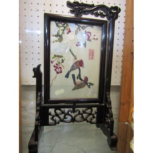 418 - ORIENTAL TABLE SCREEN, carved rosewood revolving table screen with needlework panels of birds in a f... 