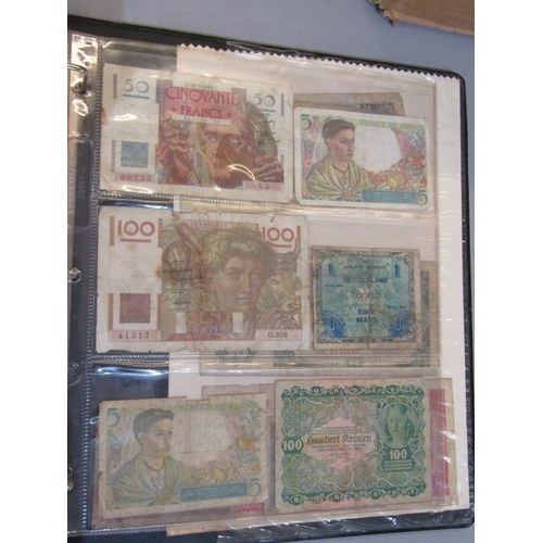 74 - Banknotes: album containing a small collection of World banknotes in well circulated condition, incl... 