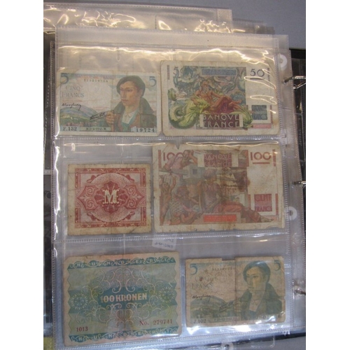 74 - Banknotes: album containing a small collection of World banknotes in well circulated condition, incl... 