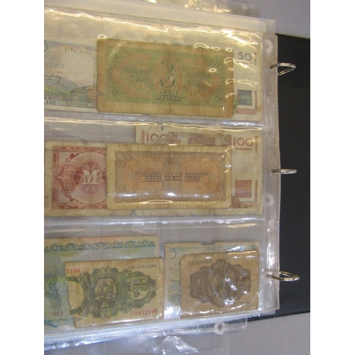 74 - Banknotes: album containing a small collection of World banknotes in well circulated condition, incl... 