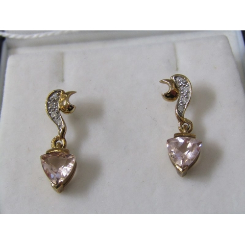 229 - TOPAZ DROP EARRINGS, a pair of 9ct yellow gold earrings set with a triangular form pink topaz, appro... 