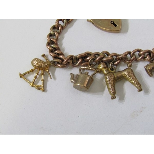 400 - GOLD CHARM BRACELET, 9ct yellow gold charm bracelet with padlock clasp, charms including a poodle, h... 