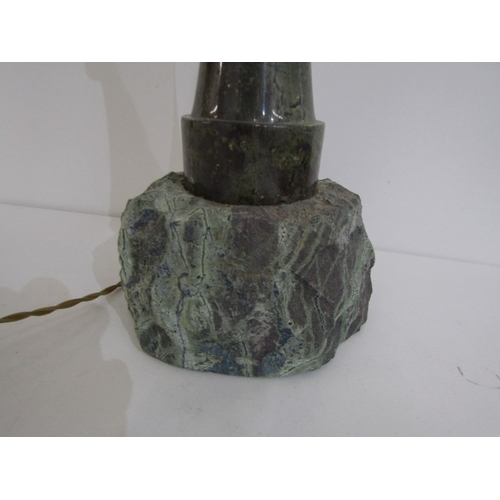 404 - SERPENTINE LIGHTHOUSE LAMP, a Cornish serpentine lamp on rocky base, height 38cm