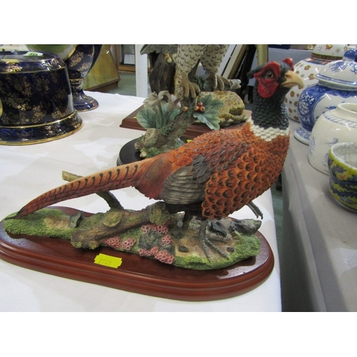 405 - ANIMAL AND BIRD ORNAMENTS, tigers on a tree base, together with a pheasant by Russell Willis and and... 
