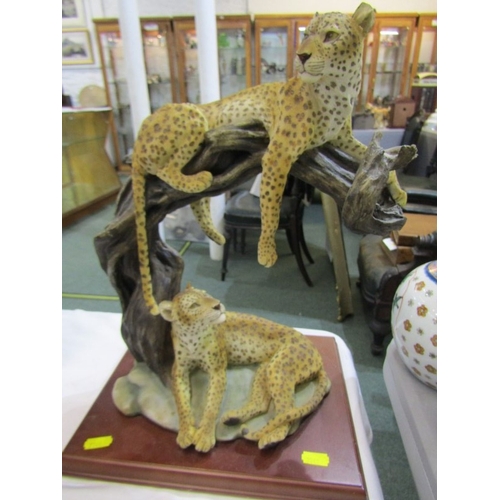 405 - ANIMAL AND BIRD ORNAMENTS, tigers on a tree base, together with a pheasant by Russell Willis and and... 