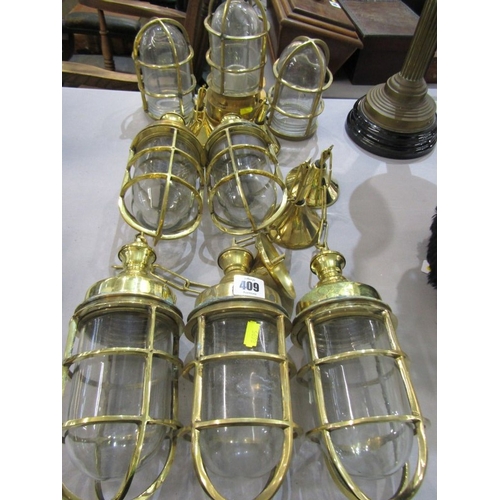 409 - LIGHT FITTINGS, 8 various brass bound ship's light fittings