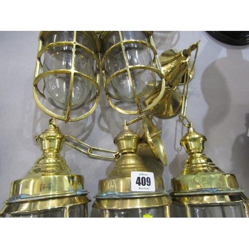 409 - LIGHT FITTINGS, 8 various brass bound ship's light fittings