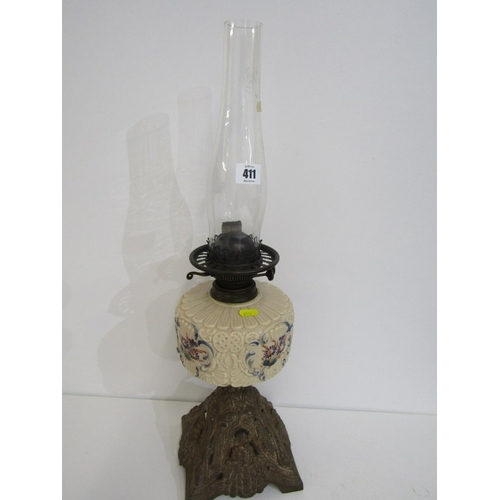 411 - VICTORIAN OIL LAMP, cast metal based oil lamp with glass central reservoir and glass chimney. Height... 