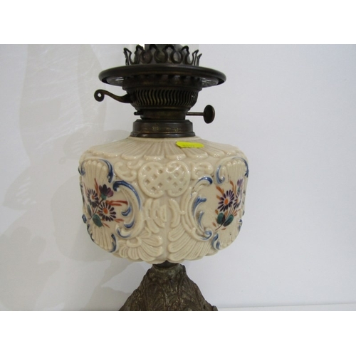 411 - VICTORIAN OIL LAMP, cast metal based oil lamp with glass central reservoir and glass chimney. Height... 