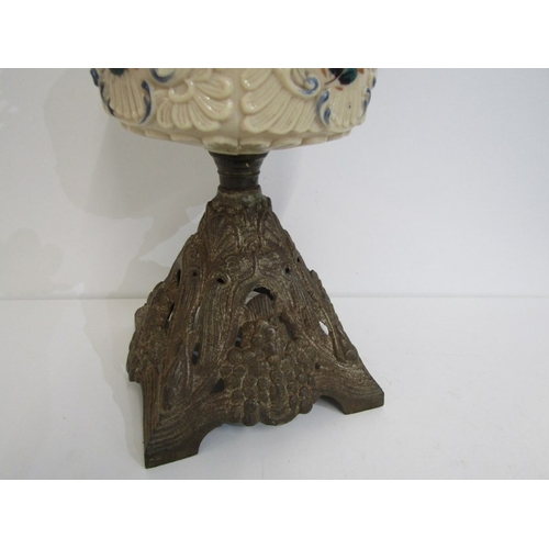 411 - VICTORIAN OIL LAMP, cast metal based oil lamp with glass central reservoir and glass chimney. Height... 