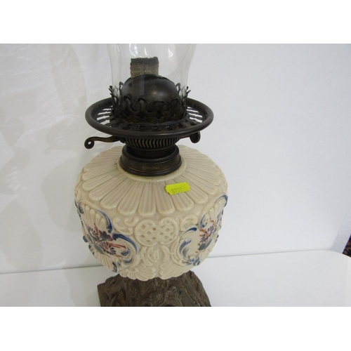 411 - VICTORIAN OIL LAMP, cast metal based oil lamp with glass central reservoir and glass chimney. Height... 
