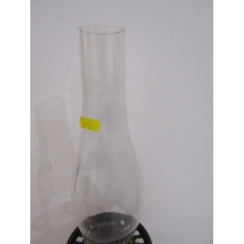 411 - VICTORIAN OIL LAMP, cast metal based oil lamp with glass central reservoir and glass chimney. Height... 