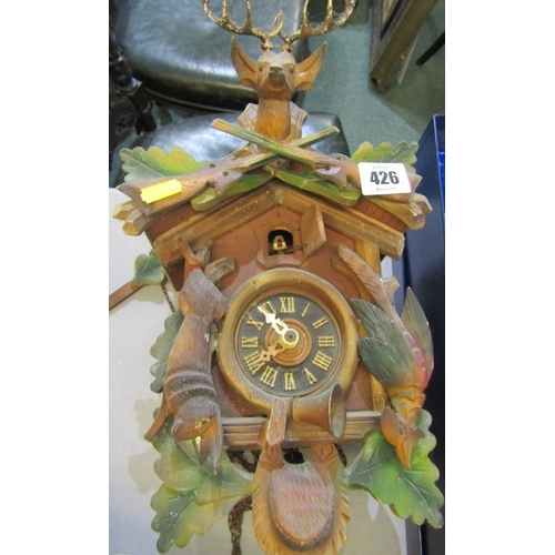 426 - CUCKOO CLOCK, a wood cased Black Forest type cuckoo clock