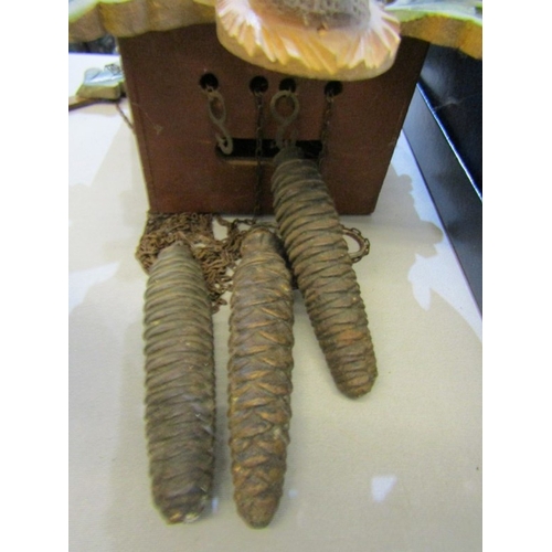 426 - CUCKOO CLOCK, a wood cased Black Forest type cuckoo clock