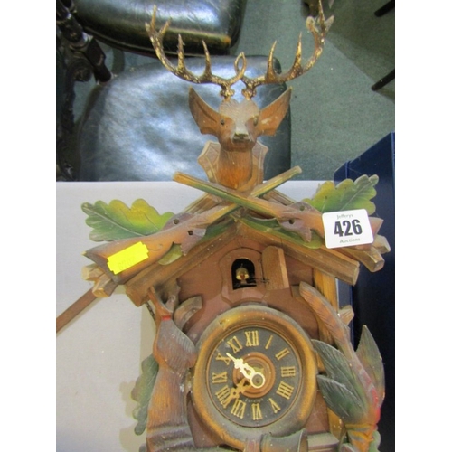 426 - CUCKOO CLOCK, a wood cased Black Forest type cuckoo clock