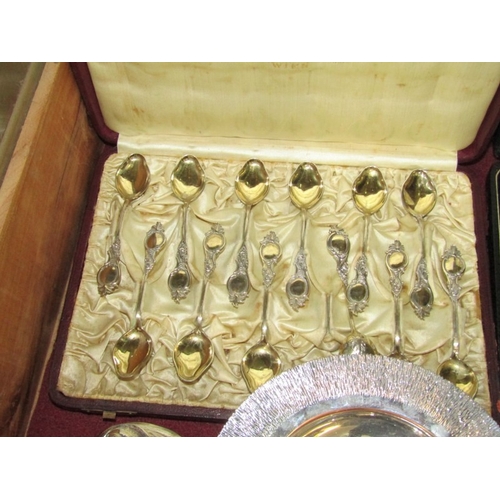 442 - PLATED CUTLERY & SILVER FACED CLOCK, GG battery watch with a foliate silver front, plated anointing ... 