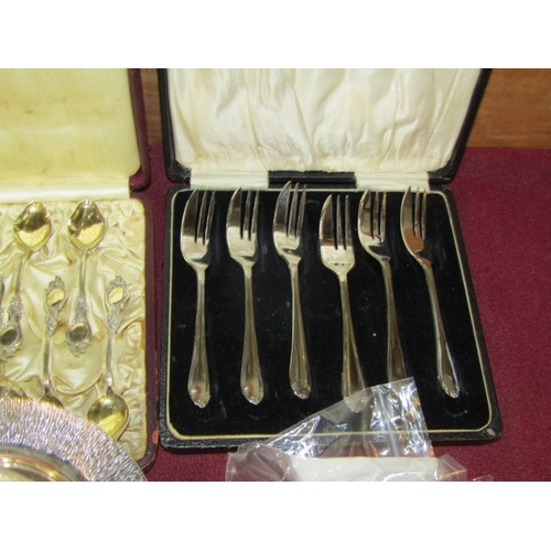 442 - PLATED CUTLERY & SILVER FACED CLOCK, GG battery watch with a foliate silver front, plated anointing ... 