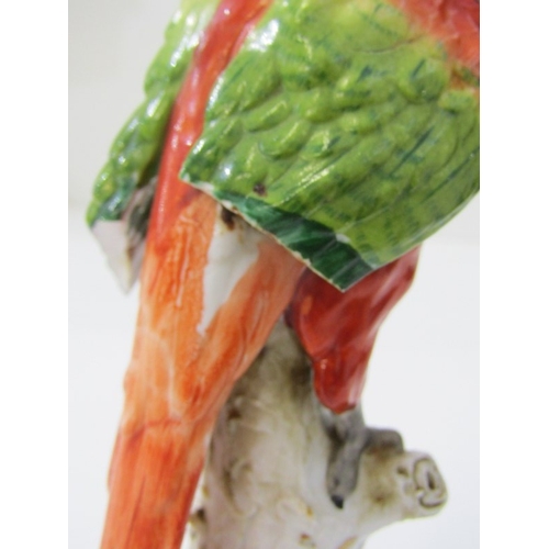 445 - HOCHST PORCELAIN, a parrot on branch, blue circular Hochst mark to base - possibly 18th Century (dam... 