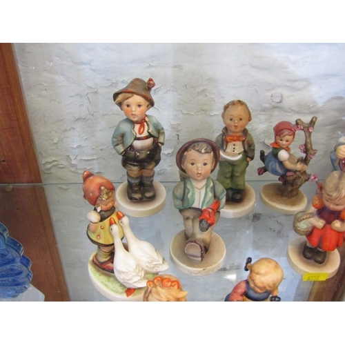 451 - HUMMEL POTTERY, various Hummel pottery figures including Appletree Girl & Skier (13 items)