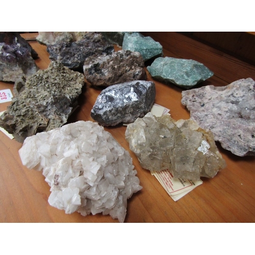 528 - MINERALS, several uncut minerals, including amethyst, fluorite, calcite, etc
